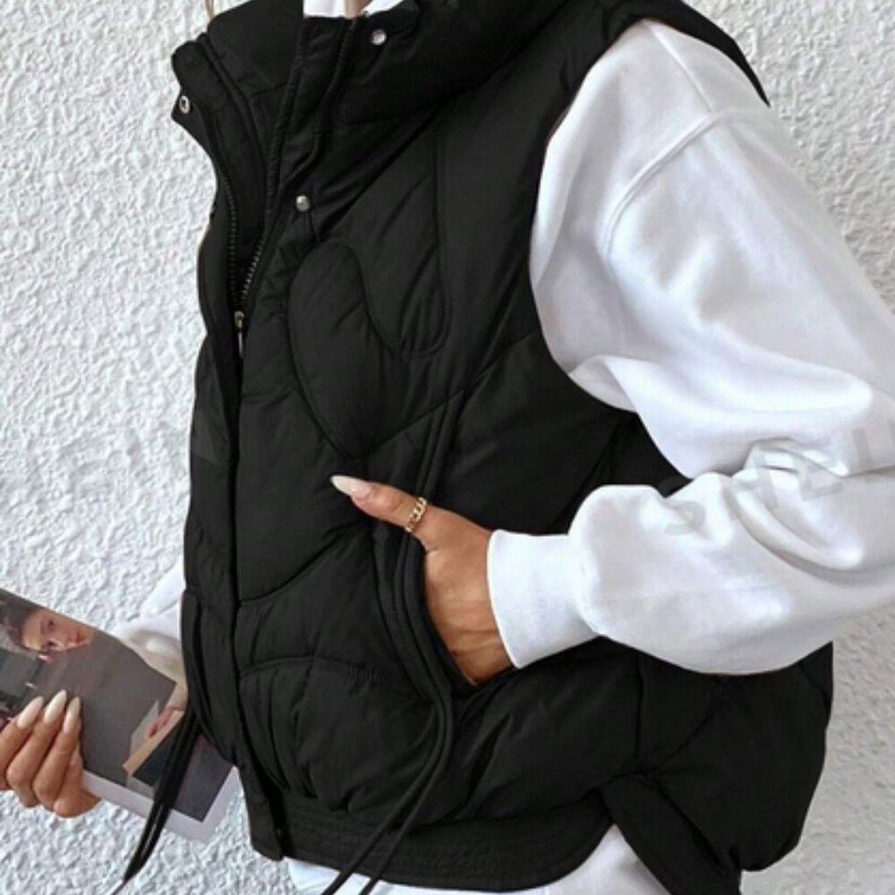 Black vest.  New.   Large. 8/10